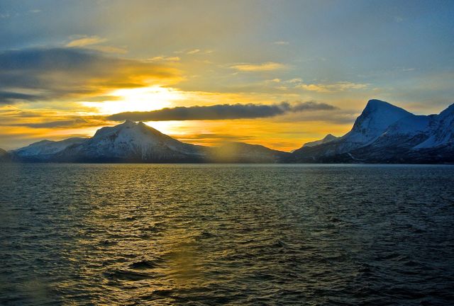 Sunrise out the porthole in northern Norway 